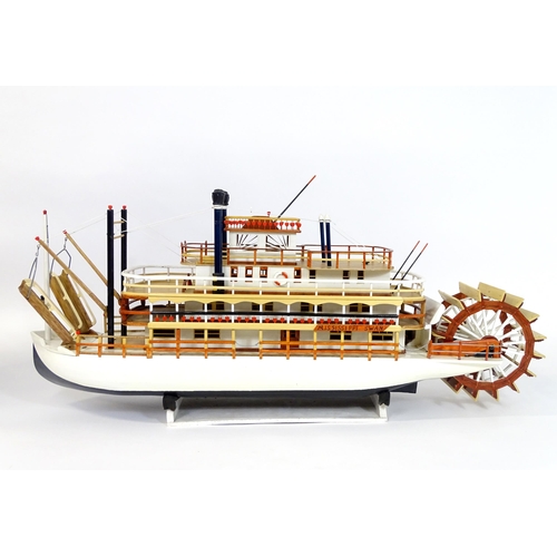 819 - A 20thC scratch built scale model of a 19thC paddle steamer boat , ' Mississippi Swan' , of wooden c... 