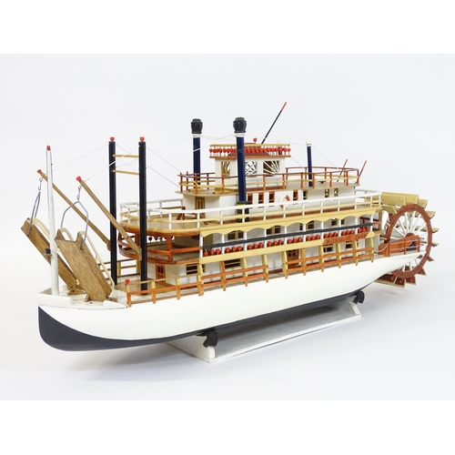 819 - A 20thC scratch built scale model of a 19thC paddle steamer boat , ' Mississippi Swan' , of wooden c... 