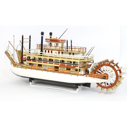 819 - A 20thC scratch built scale model of a 19thC paddle steamer boat , ' Mississippi Swan' , of wooden c... 