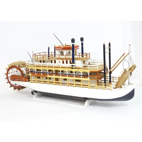 819 - A 20thC scratch built scale model of a 19thC paddle steamer boat , ' Mississippi Swan' , of wooden c... 