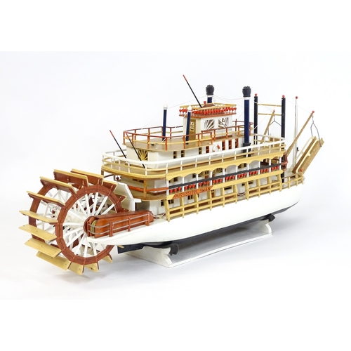 819 - A 20thC scratch built scale model of a 19thC paddle steamer boat , ' Mississippi Swan' , of wooden c... 