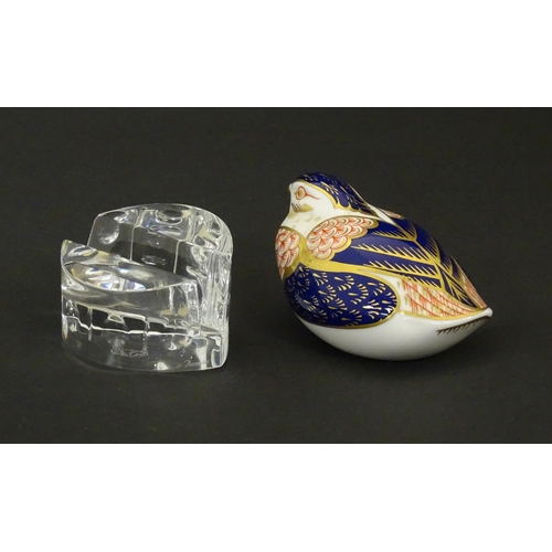 117 - A Derby paperweight modelled as a quail. Marked under. Together with a Baccarat glass stand in the E... 