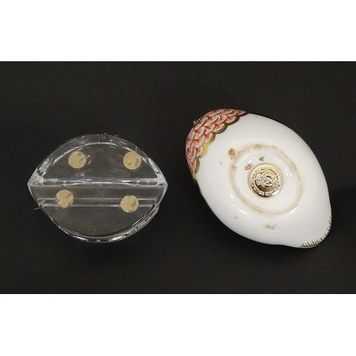 117 - A Derby paperweight modelled as a quail. Marked under. Together with a Baccarat glass stand in the E... 