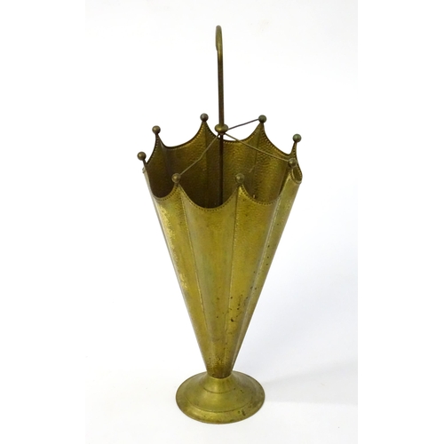 1455 - A 20thC brass stick stand in the form of an umbrella, having repousse style hammered decoration, a c... 