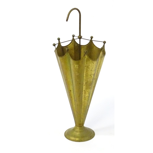 1455 - A 20thC brass stick stand in the form of an umbrella, having repousse style hammered decoration, a c... 