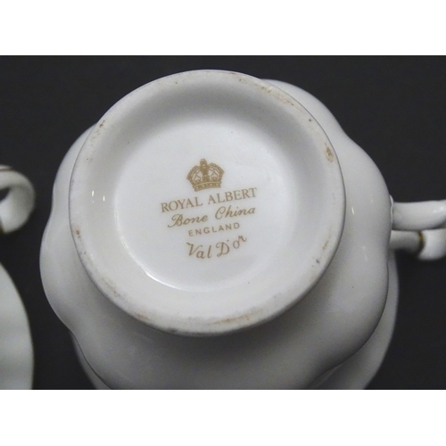 148 - A quantity of Royal Albert tea wares in the Val D'Or pattern to include teapot, cups, saucers, milk ... 