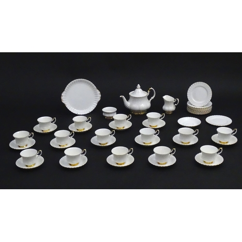 148 - A quantity of Royal Albert tea wares in the Val D'Or pattern to include teapot, cups, saucers, milk ... 