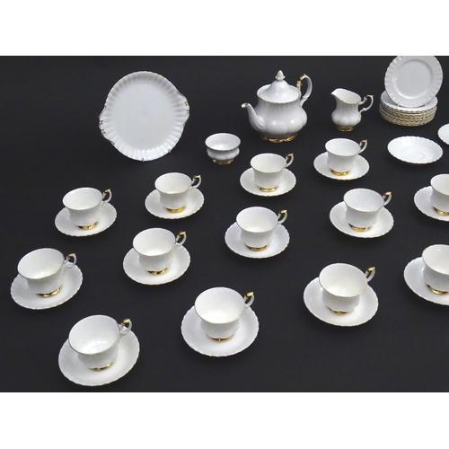 148 - A quantity of Royal Albert tea wares in the Val D'Or pattern to include teapot, cups, saucers, milk ... 