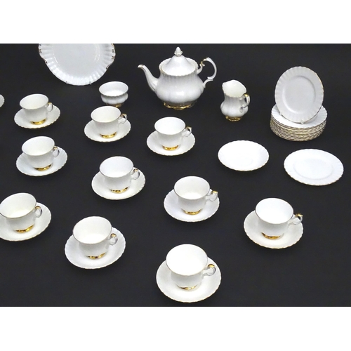 148 - A quantity of Royal Albert tea wares in the Val D'Or pattern to include teapot, cups, saucers, milk ... 