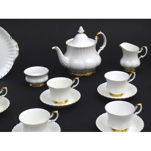 148 - A quantity of Royal Albert tea wares in the Val D'Or pattern to include teapot, cups, saucers, milk ... 