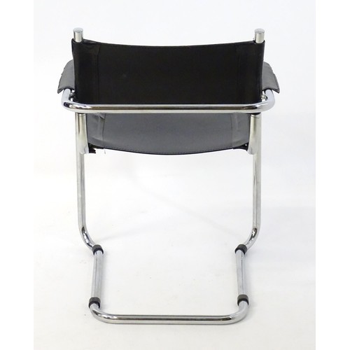 14 - A late 20thC chromed cantilever open armchair. 26