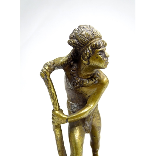 20 - A cast brass tribal figure with a feather headdress, approx 8