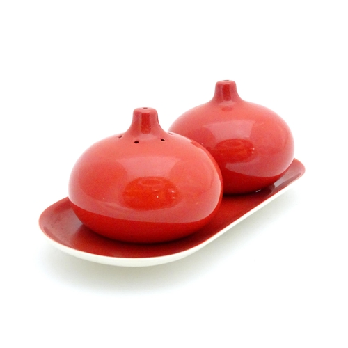 23 - A Carlton Ware cruet set on stand with a red glaze. Marked and impressed under 2955