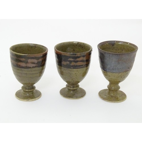 31 - A quantity of assorted Scottish studio pottery goblets / pedestal cups, some with fern detail. Large... 