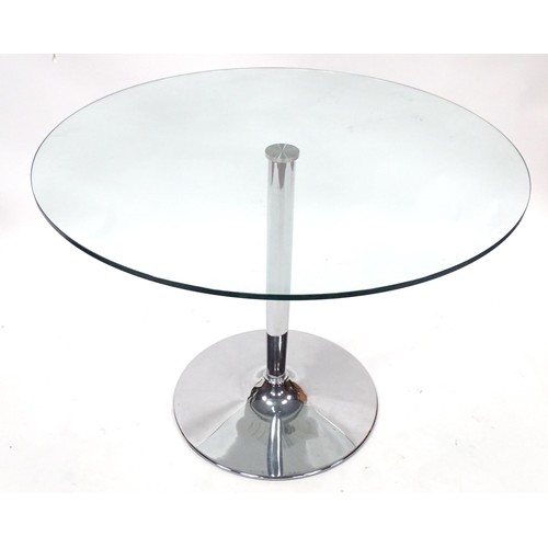 49 - A circular glass top table with a chromed metal base. Approx. 40