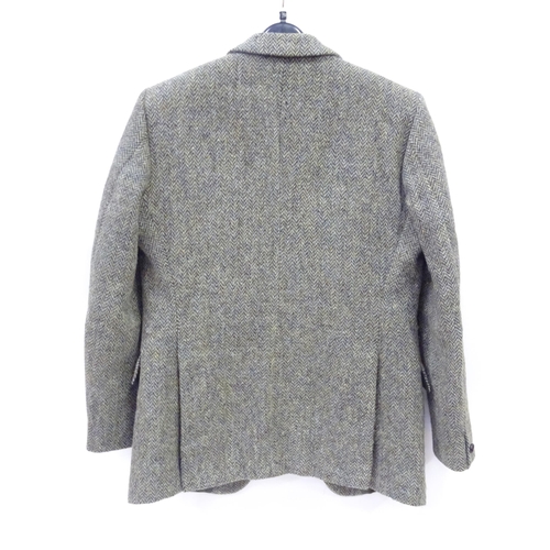 80 - A Harris Tweed hacking jacket by Gurtex, with three buttons to front and single vent to rear, measur... 