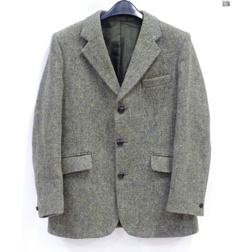 80 - A Harris Tweed hacking jacket by Gurtex, with three buttons to front and single vent to rear, measur... 