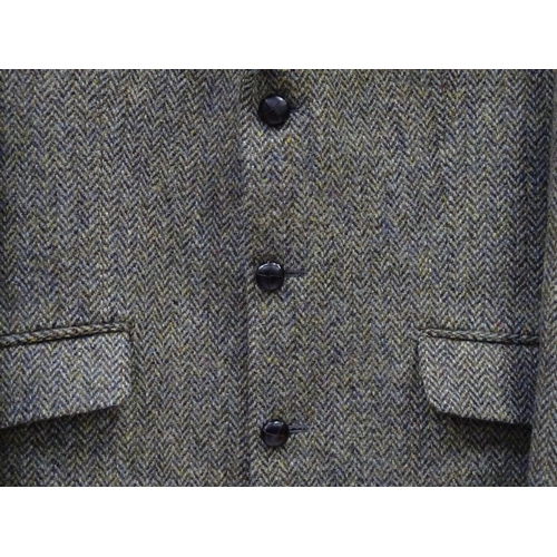 80 - A Harris Tweed hacking jacket by Gurtex, with three buttons to front and single vent to rear, measur... 