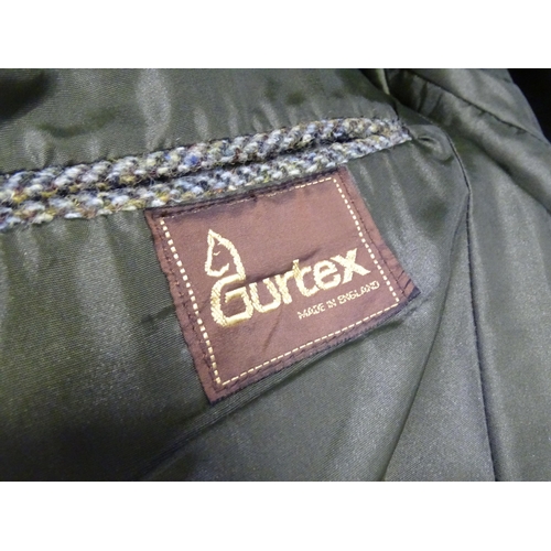 80 - A Harris Tweed hacking jacket by Gurtex, with three buttons to front and single vent to rear, measur... 