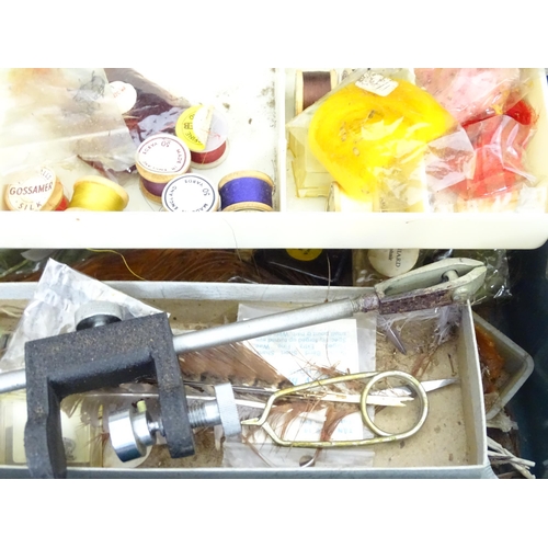 89 - A quantity of assorted fishing items to include rods, landing nets, reels, flies etc.