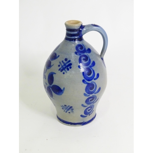 95 - A quantity of German salt glazed stoneware items to include a wine jug / ewer with blue painted deta... 