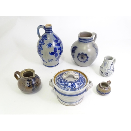 95 - A quantity of German salt glazed stoneware items to include a wine jug / ewer with blue painted deta... 