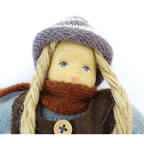 96 - Toys: Two Scandinavian / Norwegian dolls with bisque heads, the girl with a knitted hat, scarf and j... 