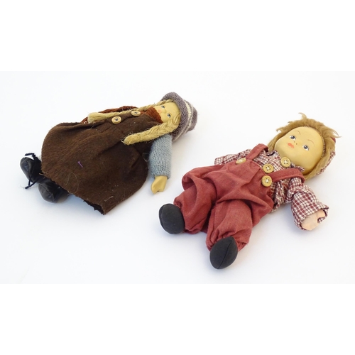 96 - Toys: Two Scandinavian / Norwegian dolls with bisque heads, the girl with a knitted hat, scarf and j... 