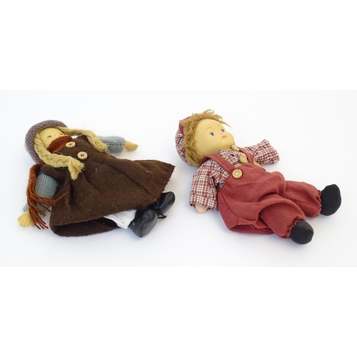 96 - Toys: Two Scandinavian / Norwegian dolls with bisque heads, the girl with a knitted hat, scarf and j... 