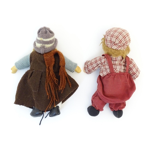 96 - Toys: Two Scandinavian / Norwegian dolls with bisque heads, the girl with a knitted hat, scarf and j... 