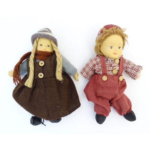 96 - Toys: Two Scandinavian / Norwegian dolls with bisque heads, the girl with a knitted hat, scarf and j... 