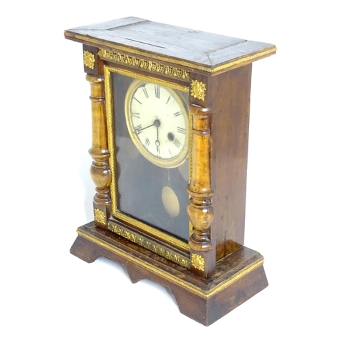 144 - A mantel clock with white enamel dial having Roman numerals and winding hole at four.