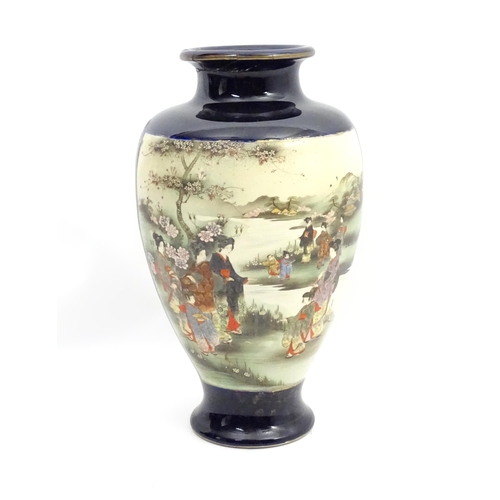 153 - A Japanese vase decorated with figures in a landscape with mountains, flowers, etc. Marked under. Ap... 