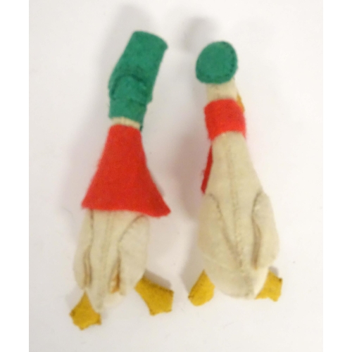 176 - Toys: Three felt animals comprising a duck wearing a hat and scarf, a duck wearing a bonnet based on... 