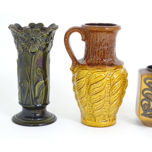 180 - Four items of German pottery to include jugs, vase, etc. Marked under. (4)