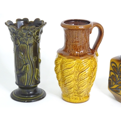 180 - Four items of German pottery to include jugs, vase, etc. Marked under. (4)