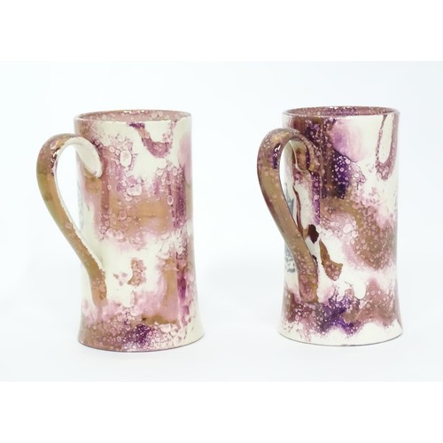 38 - A pair of Sunderland lustre style tankards with ship decoration. Approx.  6 3/4