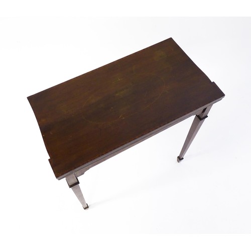 77 - A late 19thC / early 20thC mahogany card table with satinwood inlay, a crossbanded top and tapering ... 