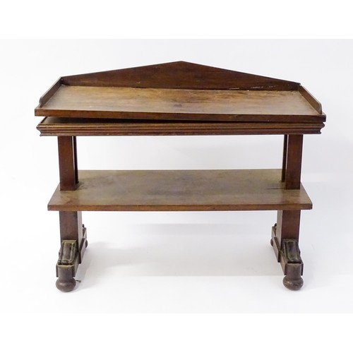 123 - A mid 19thC mahogany metamorphic buffet, with a pointed back stand, three tiers and having scrolled ... 