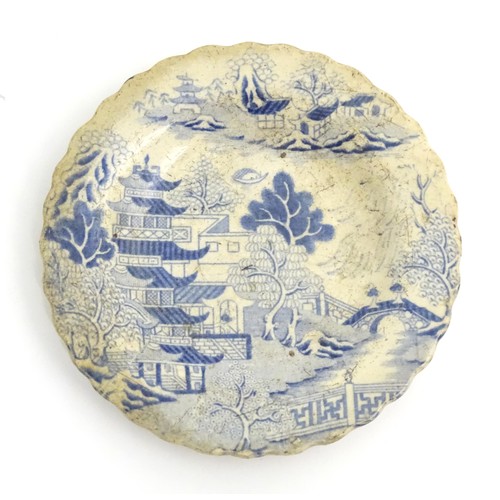 160 - Four items of blue and white ceramics, to include a Copeland Spode plate decorated in the Italian pa... 