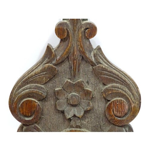 1 - An aneroid barometer with carved oak decoration. 36