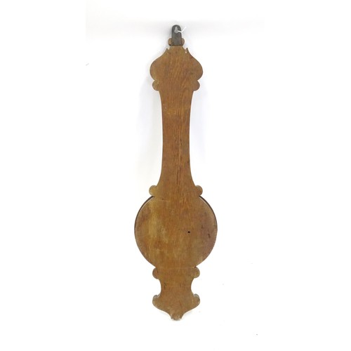 1 - An aneroid barometer with carved oak decoration. 36
