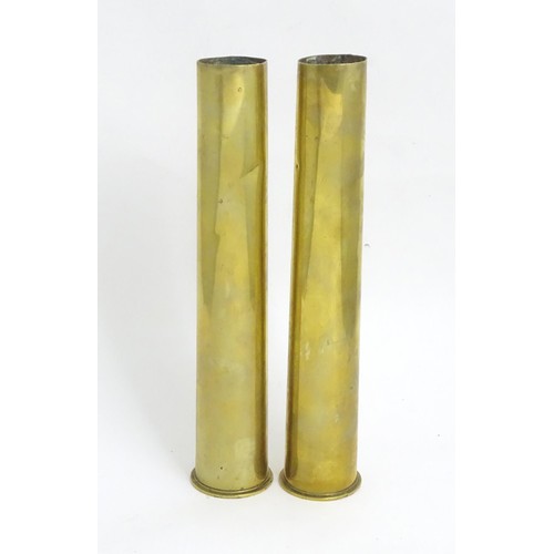 13 - A pair of trenchart style shells . Approx 11 1/2