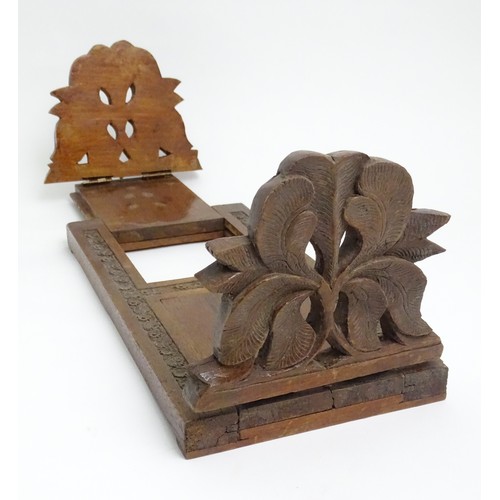 44 - A carved book slide with floral and foliate detail. 12