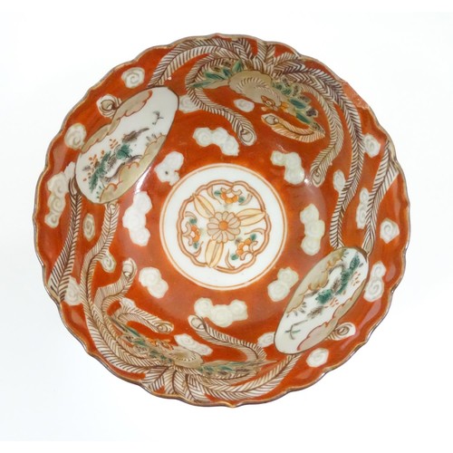 217 - An Oriental plate in the Imari palette decorated with big cat / leopard / cheetah to centre and a bo... 