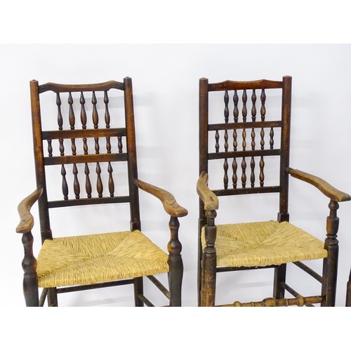 229 - A group of four (2+2) 19thC spindle back chairs with envelope rush seats. 23