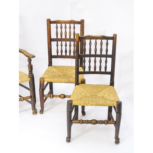 229 - A group of four (2+2) 19thC spindle back chairs with envelope rush seats. 23