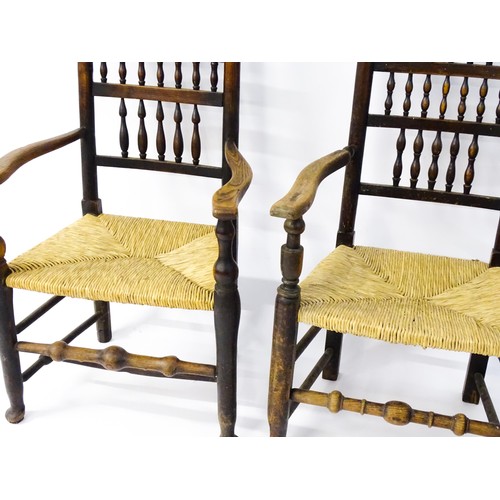 229 - A group of four (2+2) 19thC spindle back chairs with envelope rush seats. 23