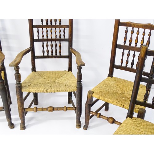 229 - A group of four (2+2) 19thC spindle back chairs with envelope rush seats. 23