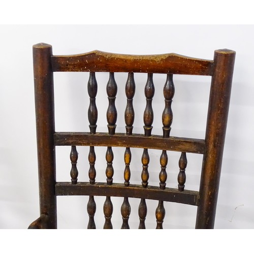 229 - A group of four (2+2) 19thC spindle back chairs with envelope rush seats. 23